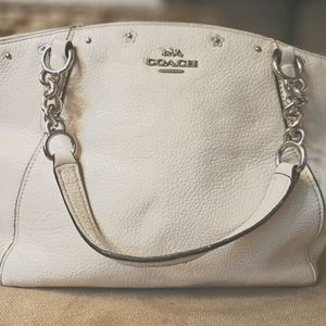 White Coach Kelsey Handbag/w grommet flower detail.